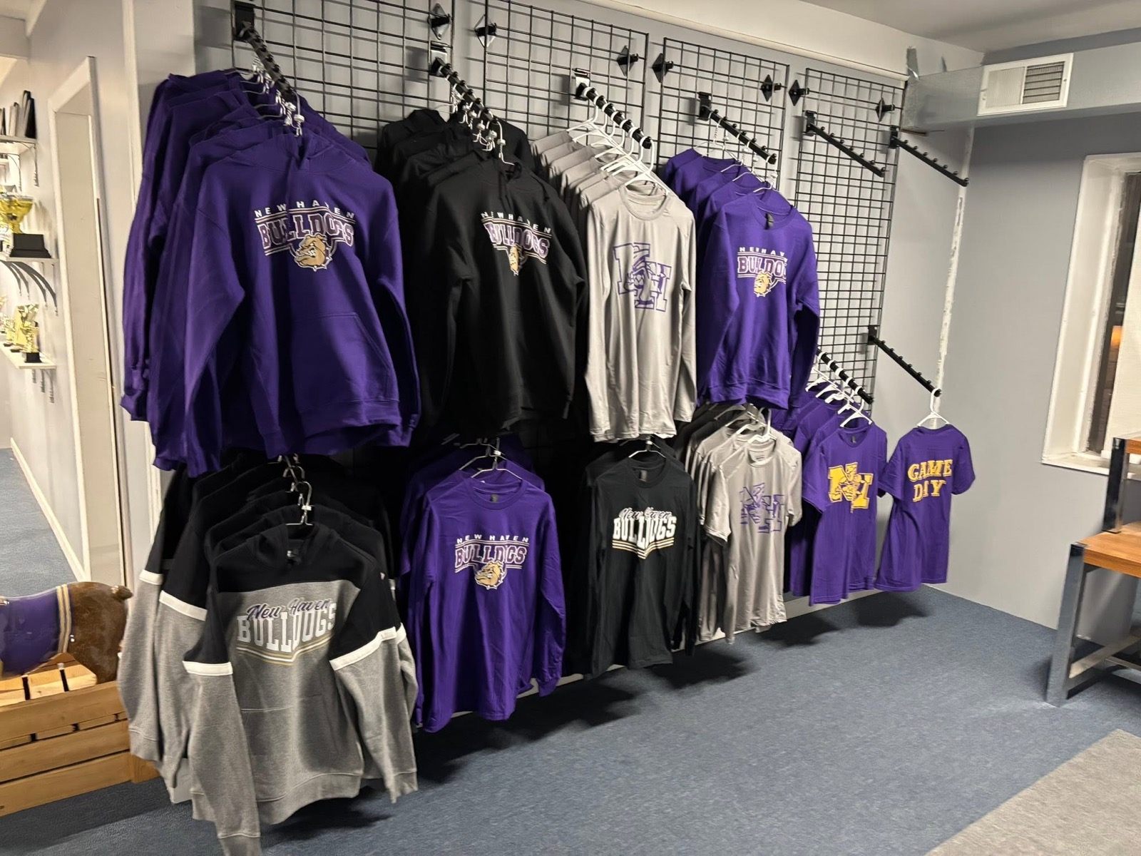 New Haven Bulldogs purple and gold hoodies and shirts on display